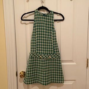 Beautiful mini dress in green and beige with two buttons in the front back zipp
